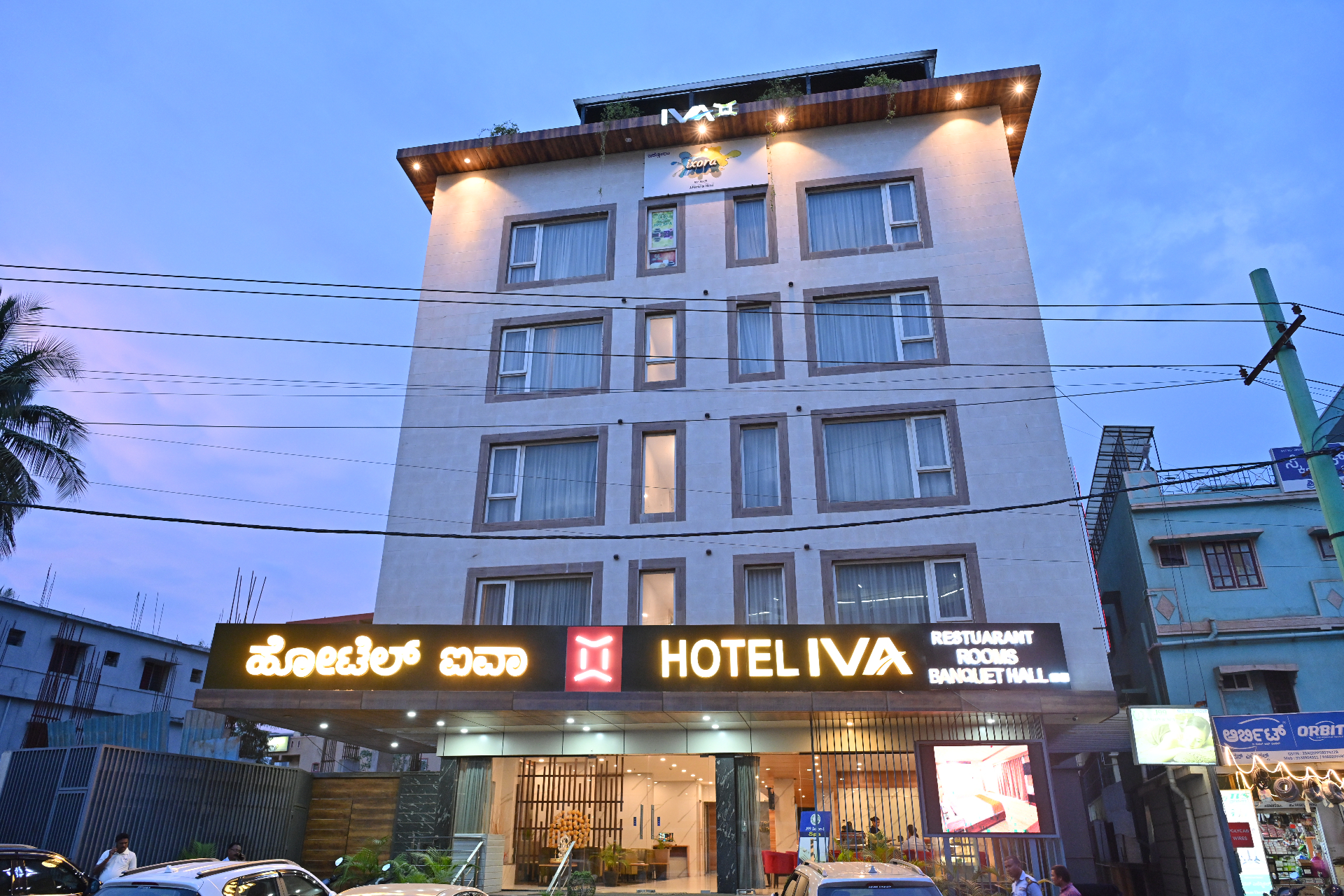 Iva By SKR Hotel exterior at dusk, Hebbagodi, Bengaluru